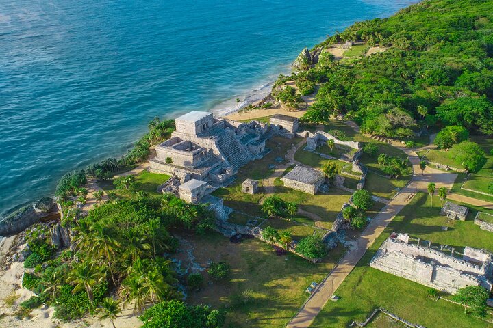 Aerial view of the impressive Tulum ruins at the edge of the beautiful turquoise waters of the Riviera Maya in the Mexican Caribbean.
