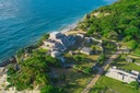 Aerial view of the impressive Tulum ruins at the edge of the beautiful turquoise waters of the Riviera Maya in the Mexican Caribbean.